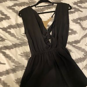 Black romper with tie front and gold detail size small